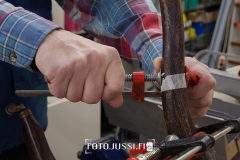 Carpenter repair the broken vintage legged chair