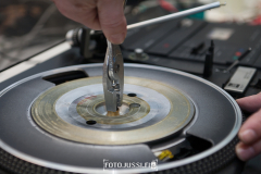 Closeup hands repair and recycling old vintage turntable vinyl record player